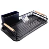 A black dish drying rack with a utensil holder and wooden handles, placed on a white background. Podgląd zdjęcia produktu