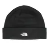 A black beanie with a white logo on the front. Produktbild-Vorschau