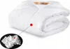 A white comforter set is folded and displayed against a white background, with a close-up inset showing the filling material. Podgląd zdjęcia produktu