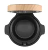 A top-down view of an open cooking pot with a wooden lid. Voir les images du produit