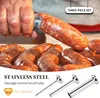 A hand is shown stuffing sausage casings with a funnel tube, with several finished sausages in the foreground. Produktbild-Vorschau