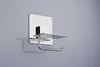 A toilet paper holder with a small shelf attached to a wall. Náhled obrázku produktu