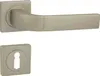 A door handle set with a square rosette and a keyhole. Produktbild-Vorschau