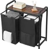 A laundry sorter with two black fabric bins and a wooden top shelf, placed on a white background.