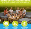 People enjoying a meal and drinks on a pallet sofa in an outdoor setting. Produktbild-Vorschau