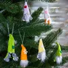 Several small gnome ornaments are hanging on a Christmas tree. Produktbild-Vorschau