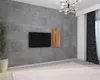 A modern living room with a concrete wall, a wall-mounted TV, and a wooden shelf. Voir les images du produit
