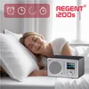 A woman sleeping in bed with a radio on the nightstand. Produktbild-Vorschau