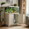 An aquarium setup with a CO2 system, plants, and fish, placed in a room. Anteprima dell’immagine prodotto