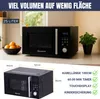 A black microwave oven is shown on a countertop with a bowl of oranges and a potted plant. Produktbild-Vorschau