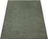 A plain, solid gray rug is shown from a slightly elevated diagonal angle against a white background. Produktbild-Vorschau