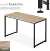 A desk with a wooden top and black metal legs, shown from a slightly elevated angle. Text overlays describe its construction and wood grain. Produktbild-Vorschau