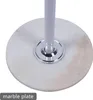 Close-up of the base of a white coat rack with a marble plate and a silver pole. Náhled obrázku produktu