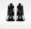 A rear view of a pair of black Converse Run Star Hike platform sneakers against a white background. Voir les images du produit