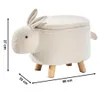 A white, fluffy bunny-shaped ottoman with wooden legs, shown from the side with dimensions indicated by measurement lines and text. Produktbild-Vorschau
