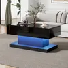 A modern living room with a black high-gloss coffee table with blue LED lighting. Produktbild-Vorschau