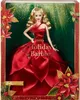 A Barbie doll in a red dress, presented in its packaging with holiday-themed decorations. Anteprima dell’immagine prodotto