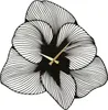 A black metal wall clock shaped like a flower with gold hands, set against a white background. Produktbild-Vorschau