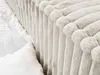 A close-up view of a light gray corduroy bed frame with white bedding. Produktbild-Vorschau