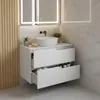 A modern white bathroom vanity with two drawers, a vessel sink, and a faucet. Produktbild-Vorschau