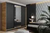 A bedroom scene featuring a wardrobe and a bed. Náhled obrázku produktu