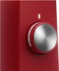 A close-up of a red stand mixer's control dial. Voir les images du produit