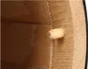 A close-up view inside a wooden barrel, showing a wooden peg inserted into the side. Produktbild-Vorschau