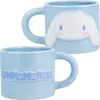 Two light blue ceramic mugs with Cinnamoroll designs. Podgląd zdjęcia produktu