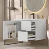 A modern white bathroom vanity with an open door revealing storage shelves filled with toiletries, and drawers partially pulled out. Náhľad obrázku produktu