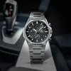 A watch is placed in a car's interior, near the gear shift. Produktbild-Vorschau