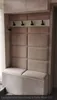 A cushioned bench and coat rack in a hallway. Náhled obrázku produktu