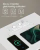 A white power strip with two outlets and two USB ports is shown embedded in a white surface, with a smartphone and a tablet connected and charging. Produktbild-Vorschau