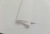 A close-up view of a white fabric, possibly a curtain or blind, with a curved edge. Produktbild-Vorschau