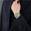 A person wearing a suit and watch. Produktbild-Vorschau