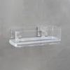 A clear acrylic shelf with a silver trim is mounted on a gray textured wall. Produktbild-Vorschau