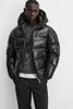A man wearing a black puffer jacket. Produktbild-Vorschau
