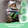 A young boy is sleeping in a bed with tractor-themed bedding. There are circular icons on the right side of the image with text and symbols related to product care and features. Produktbild-Vorschau
