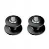 Two black pot lid handles with silver centers are shown against a white background. Náhľad obrázku produktu