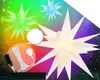 A collage of illuminated 3D star-shaped lights against a colorful, starry background, with a power cord and plug shown. Produktbild-Vorschau