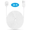 A white charging cable coiled up, with a USB connector on one end and a magnetic charging tip on the other. A blue oval with '30 ft' is visible in the upper right. Podgląd zdjęcia produktu