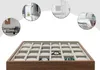 A watch organizer box with multiple compartments, surrounded by circular lifestyle images of home interiors. Podgląd zdjęcia produktu