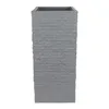 A tall, rectangular planter with a textured, stacked stone appearance. Produktbild-Vorschau