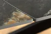 Close-up view of two table tops, showing the edge and texture. Produktbild-Vorschau