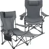 Two grey camping chairs are shown against a white background. One chair is in the foreground and has a footrest extended. The other chair is in the background and is slightly obscured. Náhled obrázku produktu