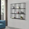 A modern living room with a blue sofa and a black metal wall shelf displaying decorative items. Náhľad obrázku produktu