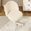 A fluffy white office chair is shown from a slightly elevated angle, placed on a rug in front of a white dresser. Náhled obrázku produktu