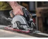 A person is using a cordless circular saw to cut a piece of wood. Náhled obrázku produktu