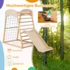 A wooden indoor climbing frame with a slide, net, and ladder, set against a backdrop of a sunlit forest. Produktbild-Vorschau