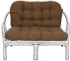 A brown cushion set on a white rattan chair. Produktbild-Vorschau