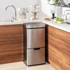 A kitchen scene with a stainless steel trash can, a coffee maker, and a cup holder. Podgląd zdjęcia produktu